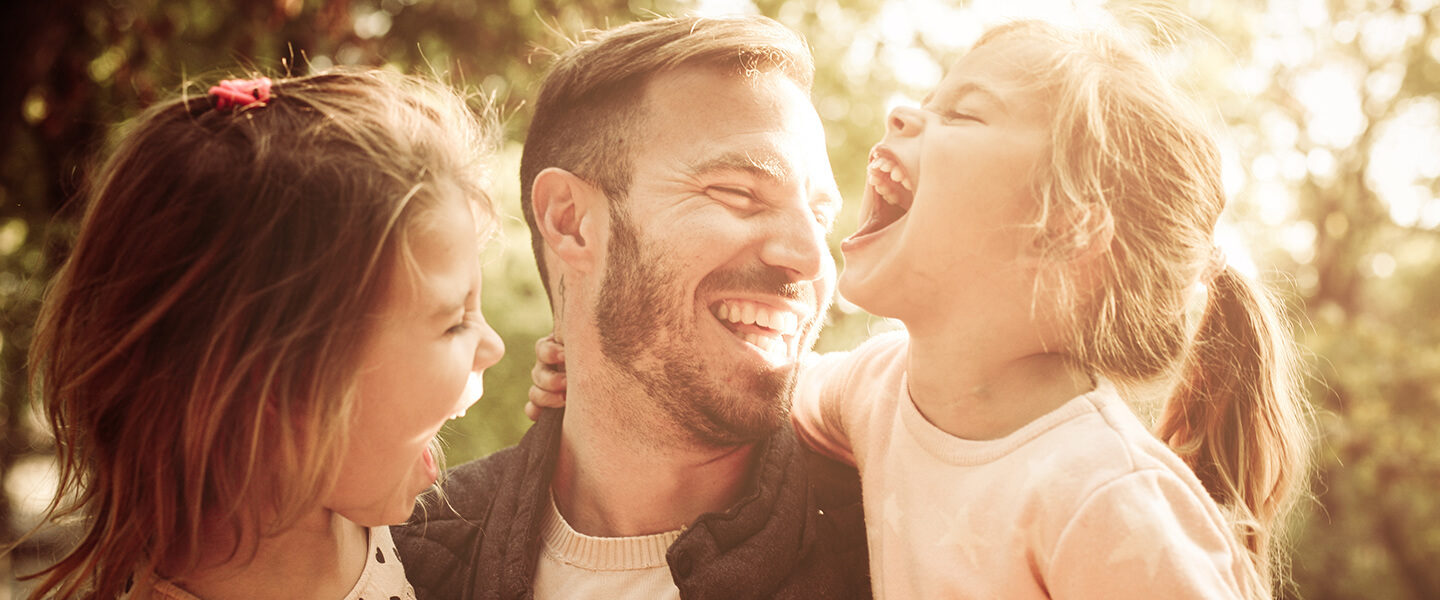 Happy family on vacation - solo dad with daughters